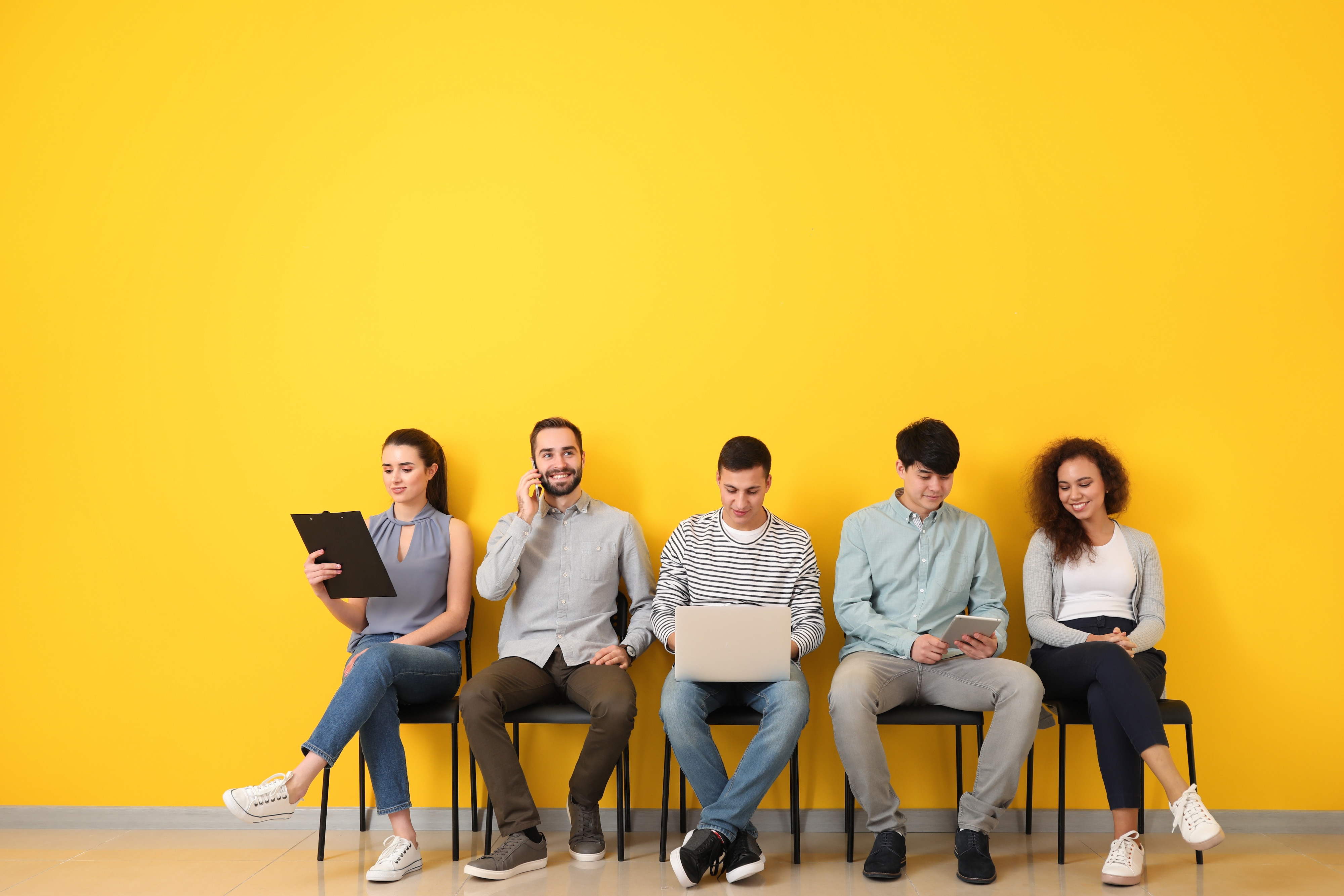 Diverse professionals waiting for interviews